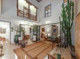 Riad Le J