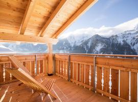 Chalet Henne- Hochgruberhof، فندق مع موقف سيارات في سيلفا دي موليني