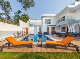 StayVista's White Pebbles - A Villa with Theater Room & Swimming Pool