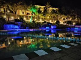 Indismart Woodbourne Resort، فندق في مادغاون