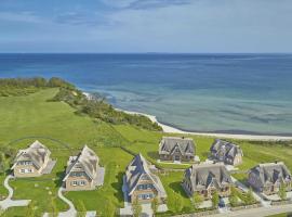 Luxus-Strandhaus "Nordperd" in Lobbe mit Meerblick, Kamin, Sauna - F661, hotel in Lobbe