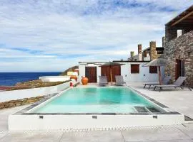 Stone villa with a sea water swimming pool and a sea and sunset view