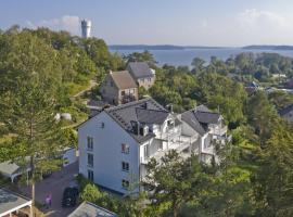 moderne Ferienwohnung mit Kamin, Balkon - Ferienresidenz Zwei Bodden FeWo111, parkimisega hotell sihtkohas Lietzow