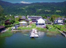 Seehaus "Kärnten Inn" mit direktem Seezugang und E-Ladestation – hotel w mieście Bodensdorf