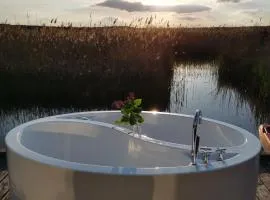 Pfahlbau Sunset II Toplage inklusive Elektroboot
