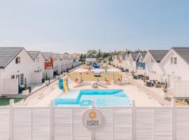 Zatoka Slonca - Domki z basenem, WiFi i parking w cenie!, hotel in Mielno