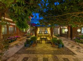 Lijiang Gui Yuan Tian Ju Guesthouse, viešbutis mieste Lidziangas