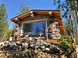 Log cabin in Lapland by the river