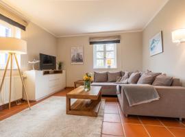 Feriendorf Rugana - Komfortplus Appartement mit 3 Schlafzimmern und Terrasse A65, hotell i Dranske