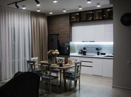 Deluxe Apartment - Tamerlan Residence, hotel in Shymkent