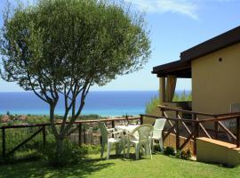 Costa Rei, villetta con splendida vista mare, giardino privato, vicino spiaggia, מלון בקוסטה ריי