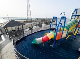 Sand Beach Suites(Families only), hotel with pools in Rayyis