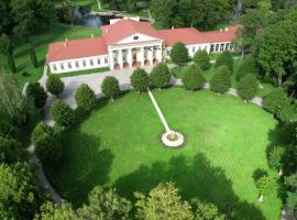Taujėnų dvaro svečių namai, alojamento na praia em Towiany
