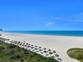 Sunny beachfront condo with pool and SW-facing balcony