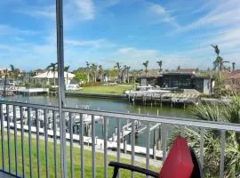 Tranquil waterfront condo with pool and steps to beach