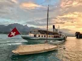 Chalet Oberhofen am Thunersee ที่พักให้เช่าติดทะเลในโอบาร์โฮเฟน อัม ธูนาร์ซี