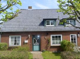 Haus 94-Whg OG, vacation rental in Oldsum