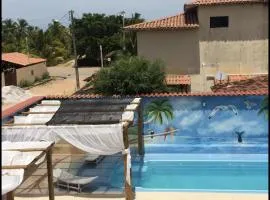 Casa Temporada Frente à Praia Piscina Ar cond Nova Viçosa VA