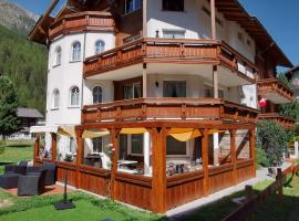 Ferienhaus mit Halbpension für 29 Personen mit 16 Doppelzimmer, hotell i Saas-Grund