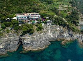 Hotel Porto Roca โรงแรมที่มีสระว่ายน้ำในมอนเตรอสโซ อัล มาเร