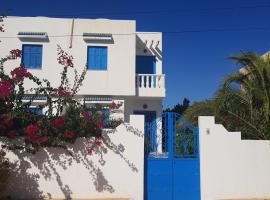 Maison les Palmiers 300m de la plage, ваканционна къща в Aghīr