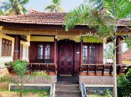 Kerala cottage, B&B/chambre d'hôtes à Varkala