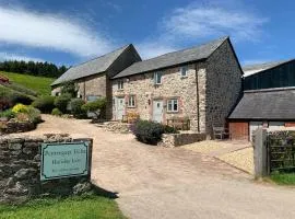 The Nook at Pentregaer Ucha, with tennis court & lake.