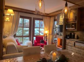 Arc 1950 appt luxe 2-4pers -skis aux pieds-SPA-piscines intérieure et extérieure-sauna-hammam, hotel a Arc 1950