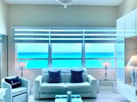 Large luxurious direct ocean front Penthouse or Deluxe one bedroom ocean front condo-free parking