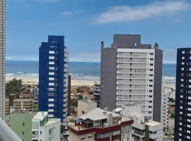 Apartamento com Vista Oceânica, hotel keluarga di Torres