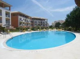 Luxurious first floor apartment with balconies overlooking pool and gardens.