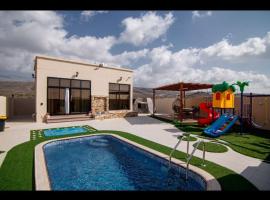 Estrahet Al Haitham, hotel dengan kolam renang di Al Qal‘ah