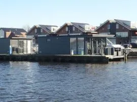 Modern houseboat with air conditioning located in marina