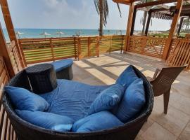 Breathtaking Luxury & Spacious 2-Bedroom 1st Row Direct Seaview at Stella Sea View Sokhna, vacation home in Ain Sokhna