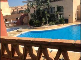 Apartamento Punta Umbría Parking Incluido y Piscina, alquiler vacacional en la playa en Punta Umbría