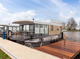 Houseboat 'Elysium' met eigen aanlegsteiger Sneek - Offingawier, hotel in Offingawier