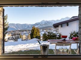 Charmantes Apartment mit grossem Garten .Kids4free., hotel v destinácii Flims