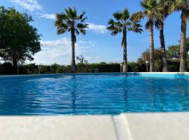 Villa Rosella appartamento 2 - con piscina - 150 m dal mare, aluguel de temporada em Casa Margherita
