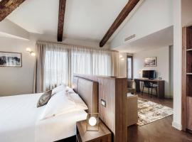 Porta Altinia Suites, отель в Тревизо