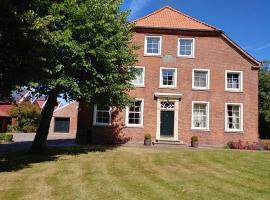 Ferienwohnung im idyllischen Gulfhof, Hotel in Krummhörn