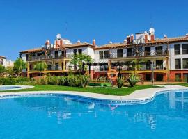 Apartamento con jardín privado y acceso a piscina, hôtel accessible aux personnes à mobilité réduite à Huelva