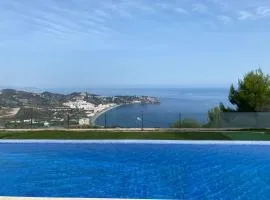 Half of the luxury villa with sea view and pool in natural park