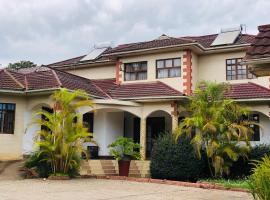 KAMAO Hotel, hótel í Arusha