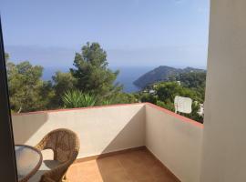 Semi-detached house, with an impressive view of the sea and the valley, holiday home in Sant Joan de Labritja
