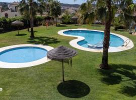 ELL001 Casa adosada de 2 dormitorios, hotel en Ayamonte