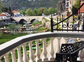 Apartments FLORA and boat cruising, hotel in Virpazar