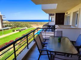 Relaxing Beachfront Apartment, hotel with pools in Vokolidha