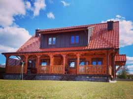 Sielski Spok&oacute;j Dom z bali Apartamenty całoroczne, chata v destinaci Gietrzwald