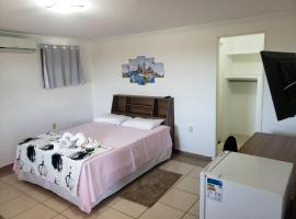 Enseada Su&iacute;tes, guest house in Guarapari