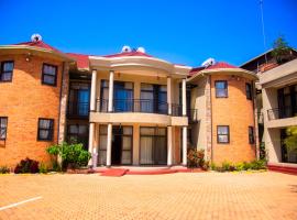 QUALITY INN HOTEL Kigali, poilsiautojų namelis mieste Kigalis